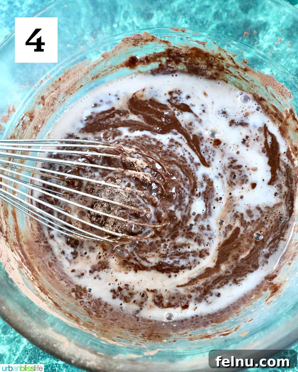 Reindeer Delight Cupcakes 8 Whisking together cupcake ingredients in a large bowl