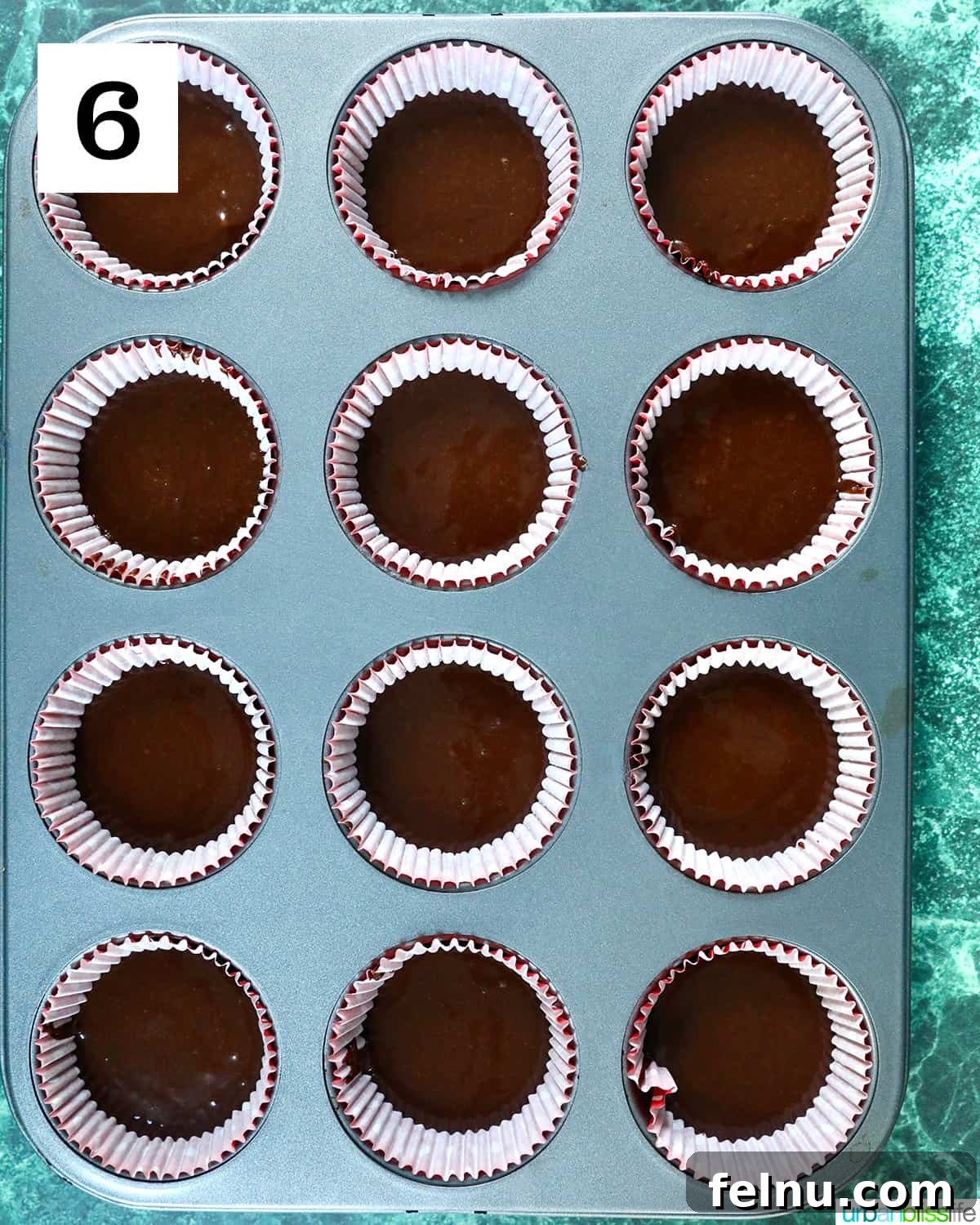 Reindeer Delight Cupcakes 10 Chocolate cupcake batter in a muffin tin, ready for baking