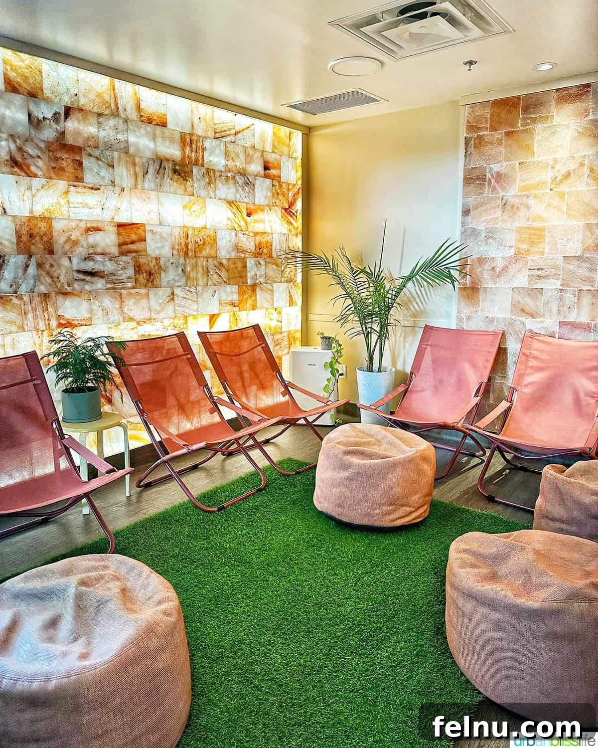 A calming pink salt room at Ritual Nordic Spa, featuring a wall of Himalayan salt blocks for relaxation and detox.