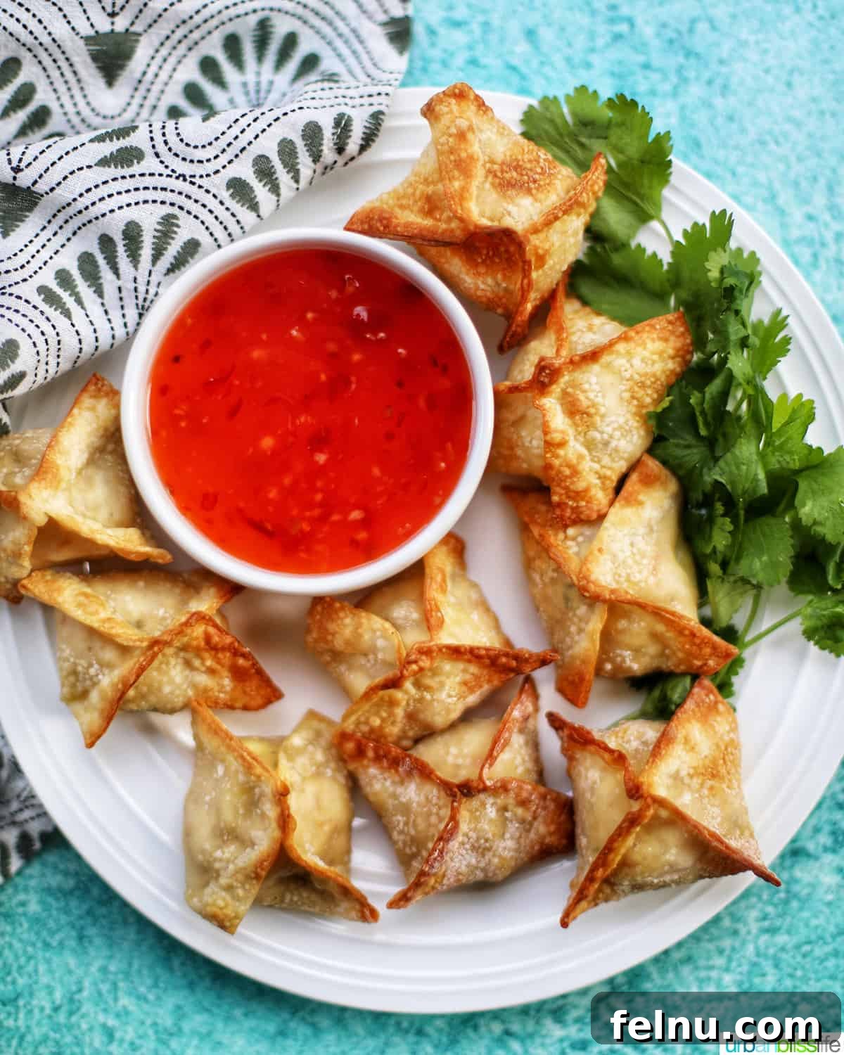 17 Must-Try Asian Side Dishes 2 Crispy Air Fryer Crab Rangoon with sweet chili dipping sauce, a perfect Asian side dish.