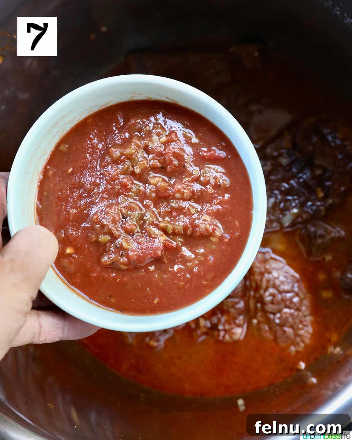 Slow-Cooker Fiesta Shredded Beef 11 Adding salsa to the Instant Pot.