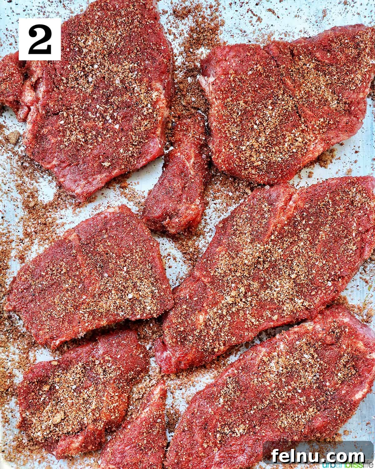 Slow-Cooker Fiesta Shredded Beef 6 Seasoned beef on a tray.