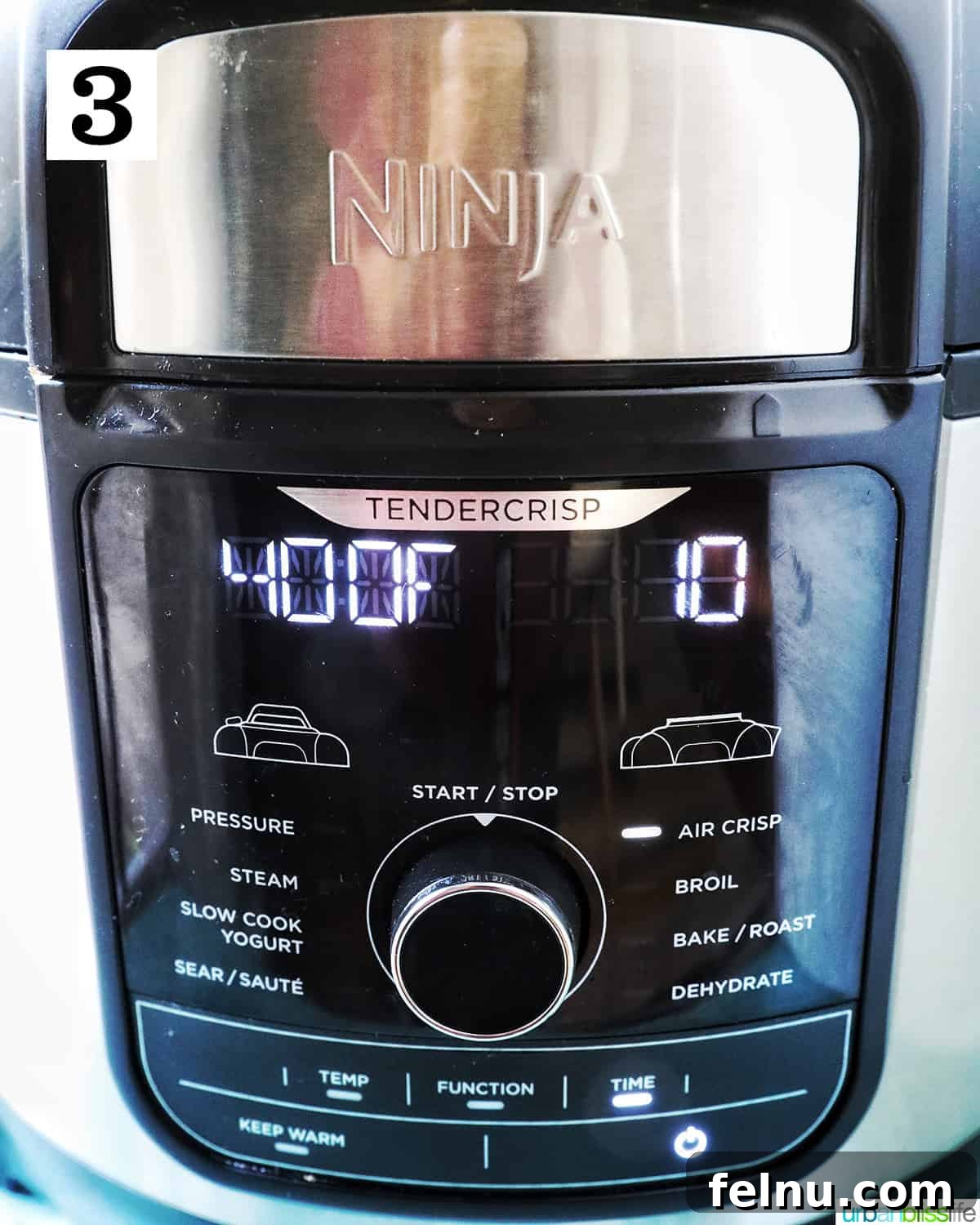 Crispy Air Fryer Popcorn Shrimp 7 The Ninja Foodi air fryer display showing settings of 400 degrees Fahrenheit and a 10-minute cooking timer for perfect popcorn shrimp.