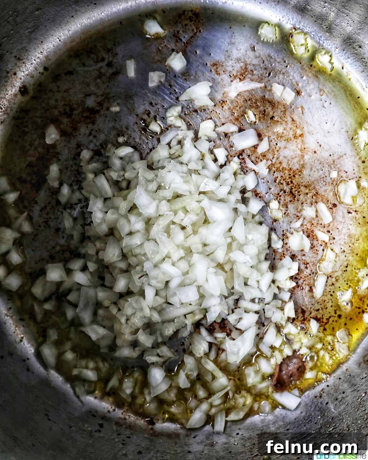 Tender Instant Pot Sirloin Tip Roast 8 minced garlic and diced onions sauteing in an Instant Pot.