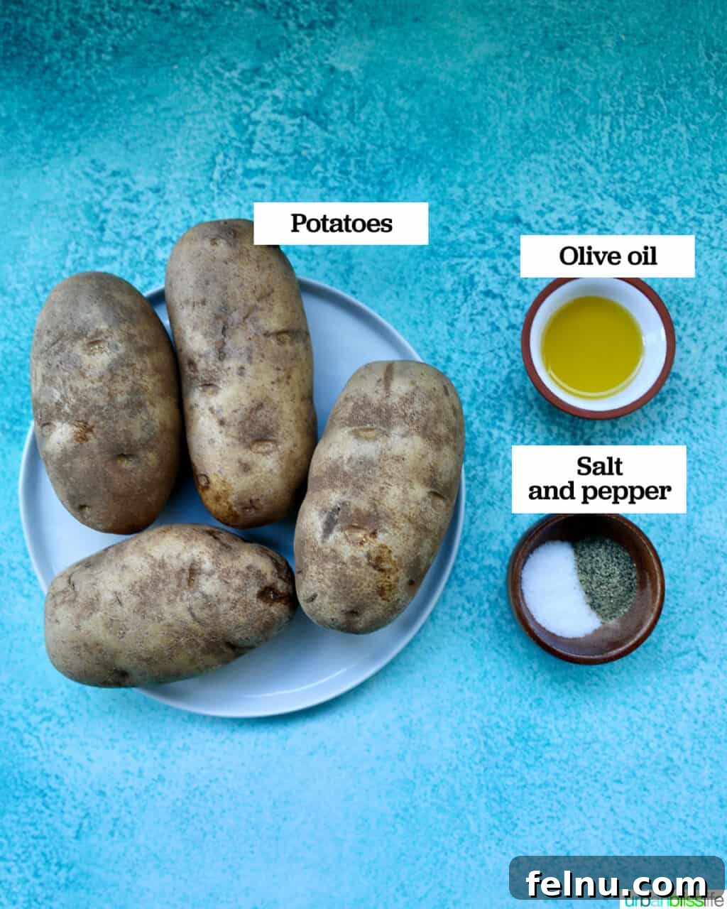 Crispy Fluffy Ninja Foodi Air Fryer Baked Potatoes 4 russet potatoes on a plate with bowls of olive oil and salt and pepper.