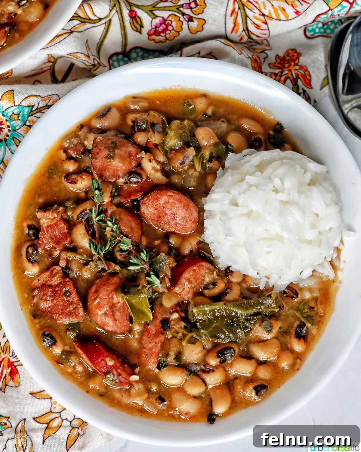 Quick Instant Pot Black Eyed Peas Soak Free 2 Instant Pot black eyes peas with scoop of white rice in a white bowl.