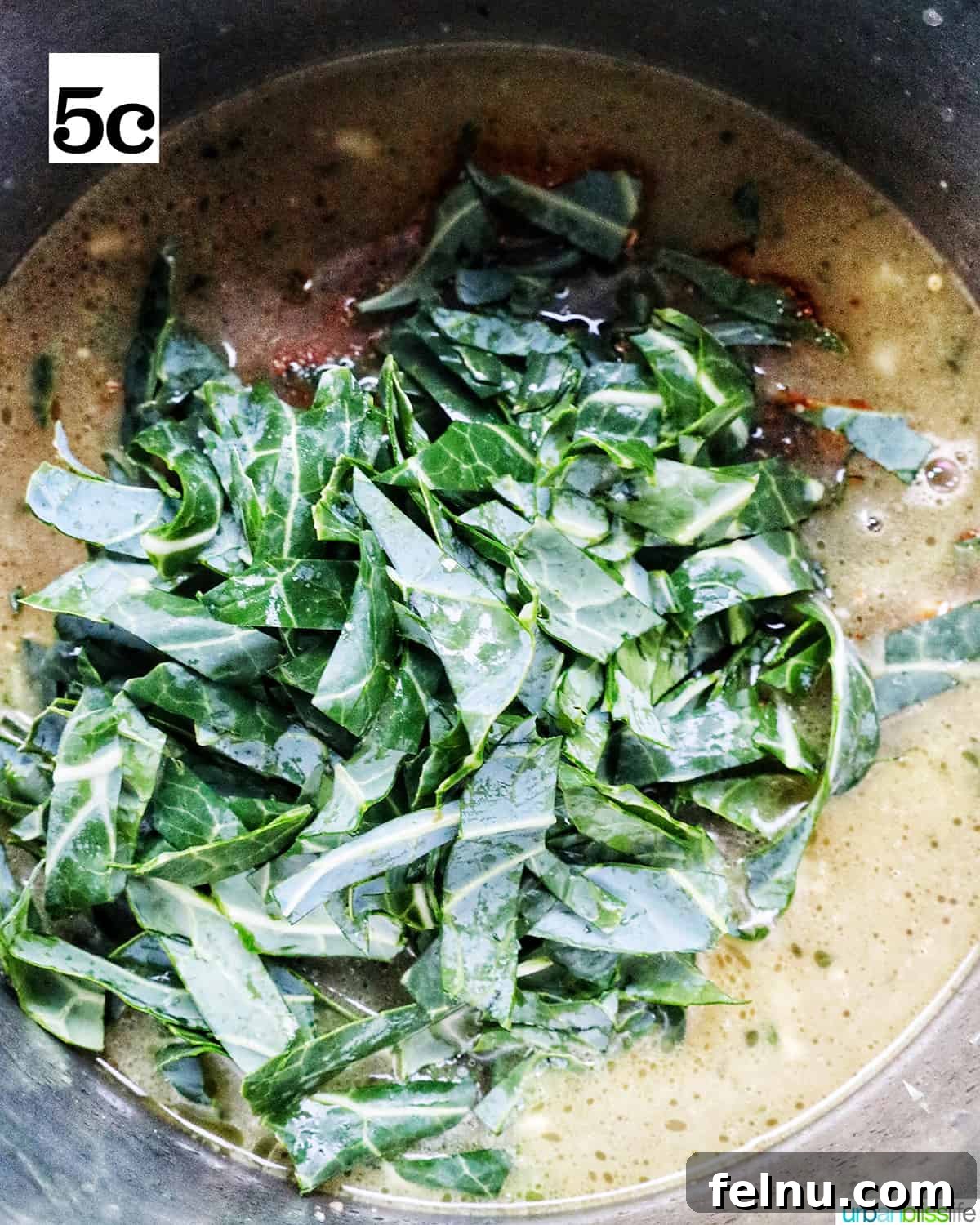 Quick Instant Pot Black Eyed Peas Soak Free 11 chopped collard greens added to the top of black eyed peas in the Instant Pot.