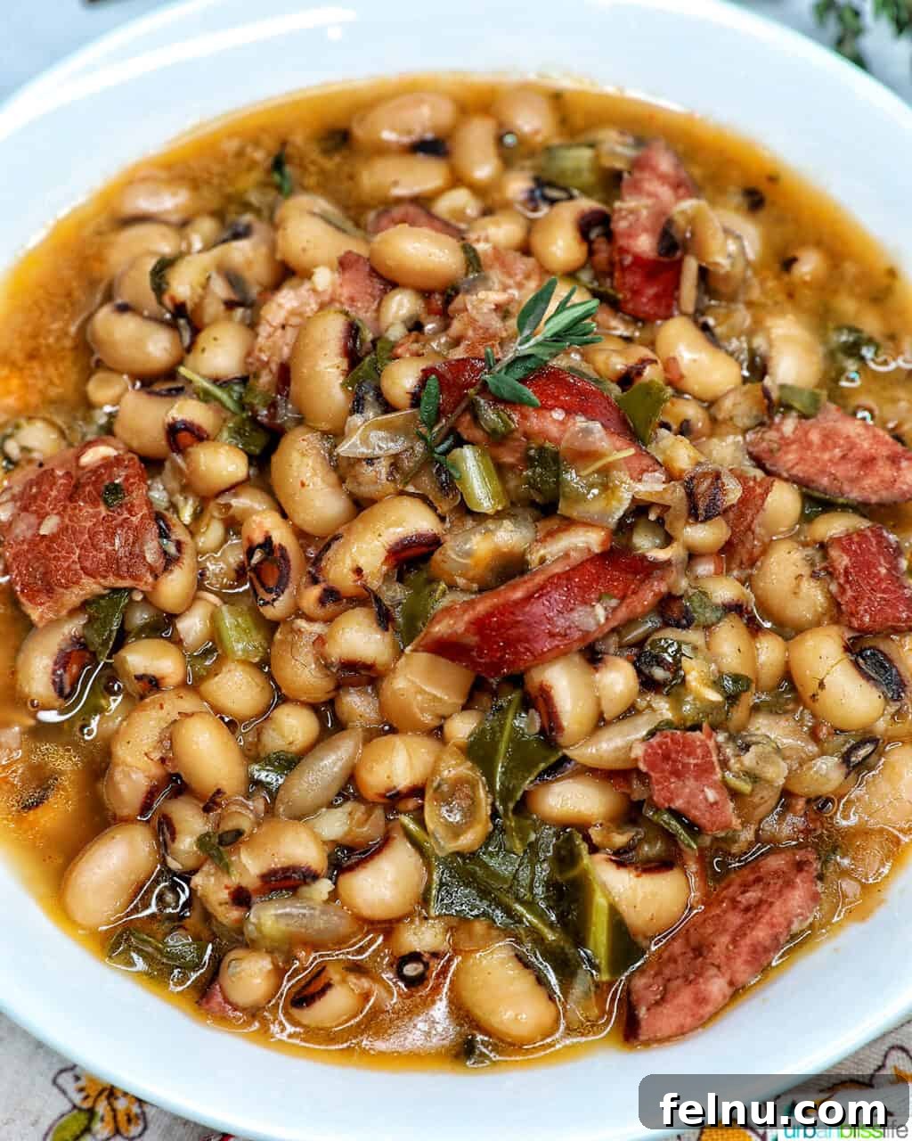 Quick Instant Pot Black Eyed Peas Soak Free 16 Instant Pot black eyed peas with scoop of white rice in a white bowl.