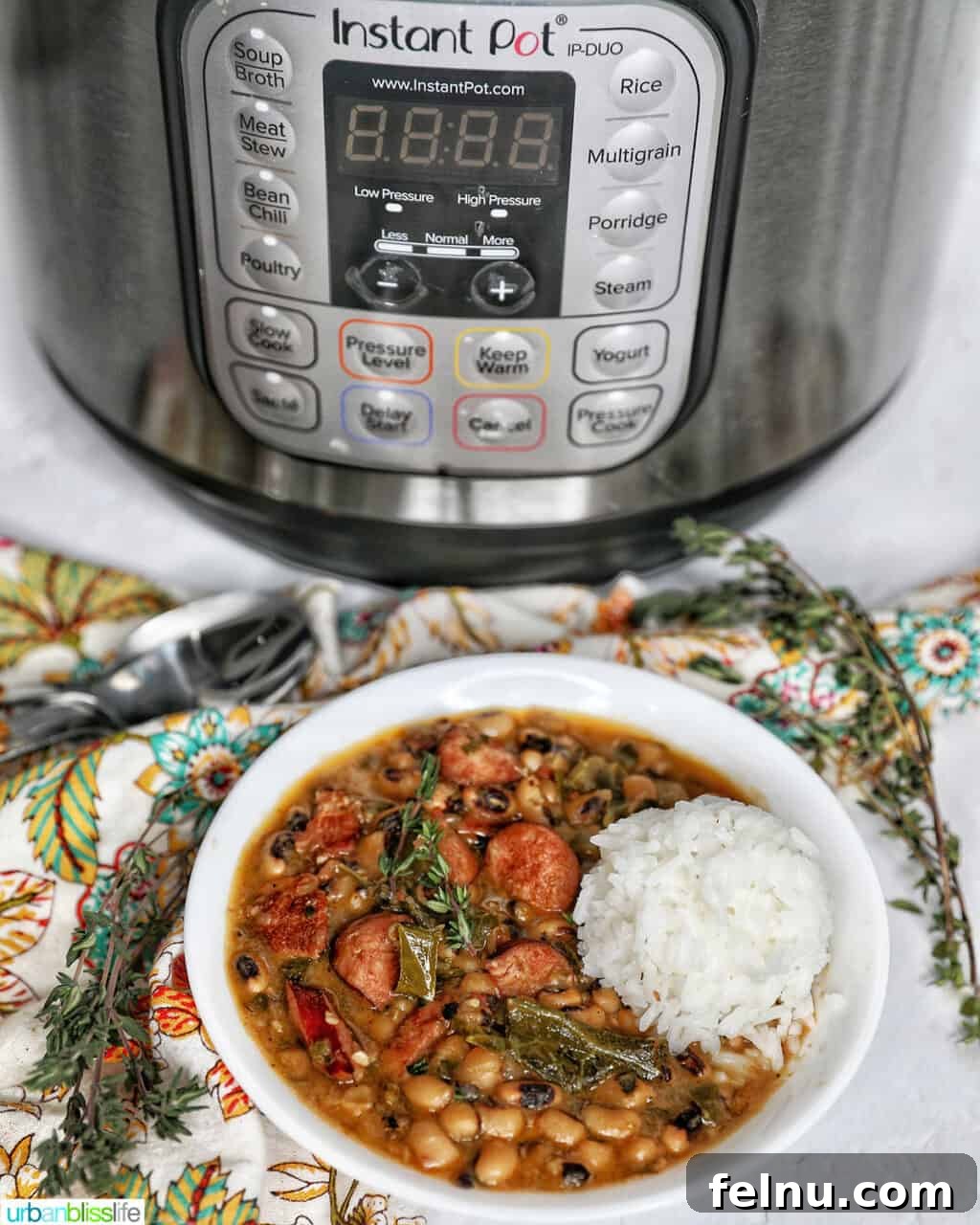 Quick Instant Pot Black Eyed Peas Soak Free 18 Instant Pot black eyes peas with scoop of white rice in a white bowl in front of an Instant Pot.