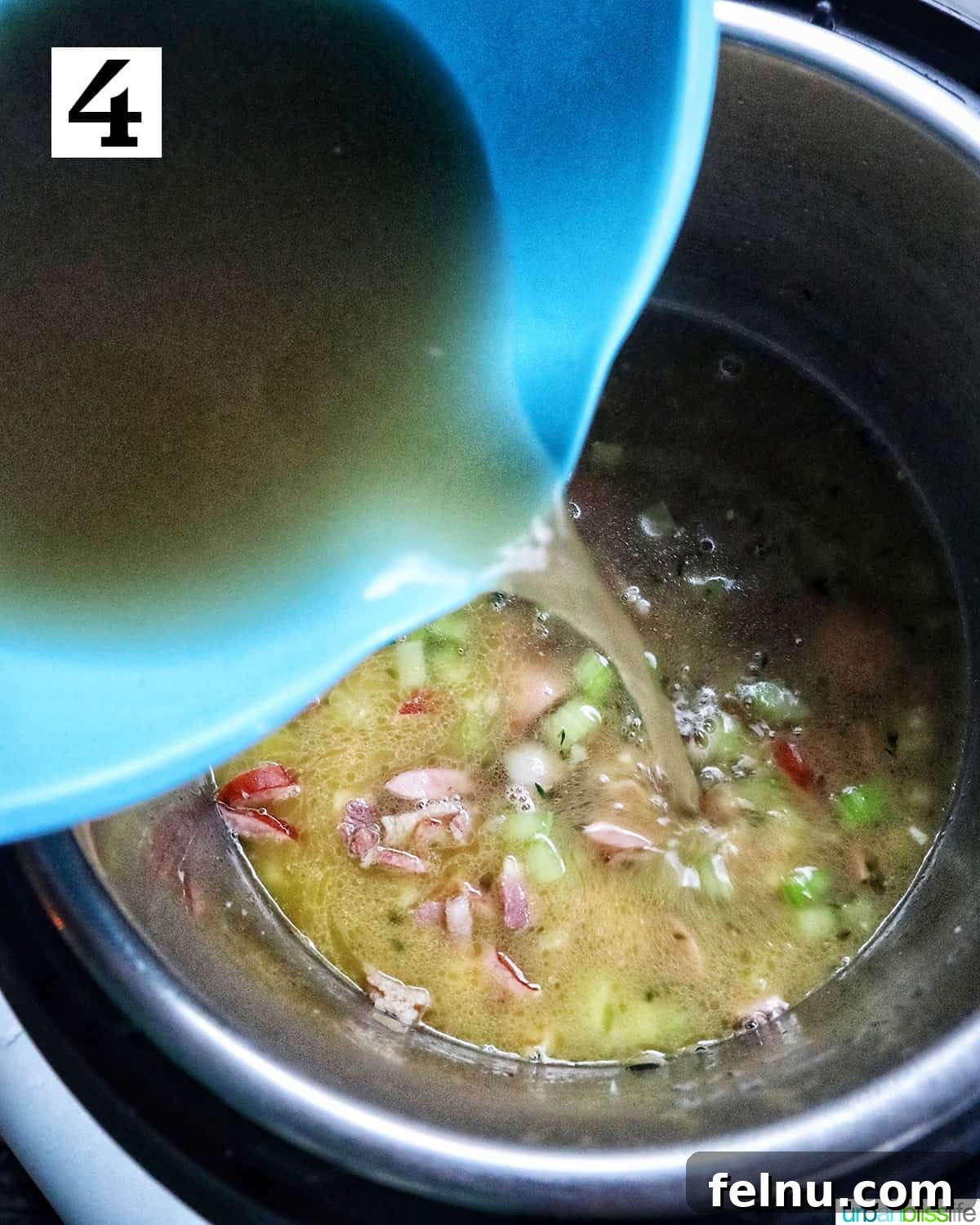 Quick Instant Pot Black Eyed Peas Soak Free 8 blue bowl pouring chicken broth into the black eyed peas in the instant pot.