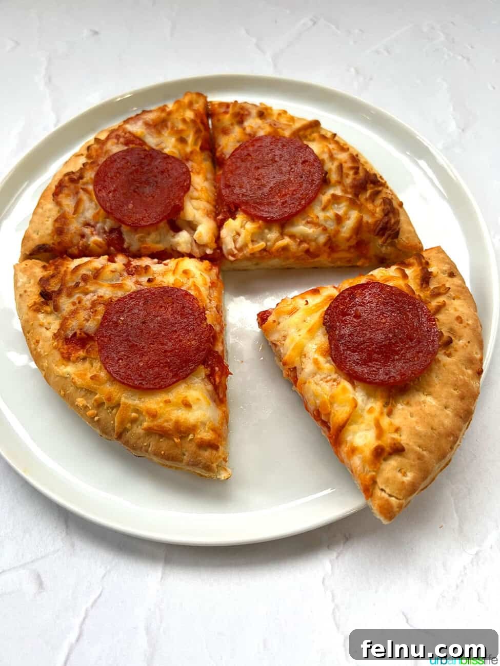 Air Fryer Pizza Perfection 8 A slice of perfectly cooked air fryer frozen pizza, ready to be enjoyed.