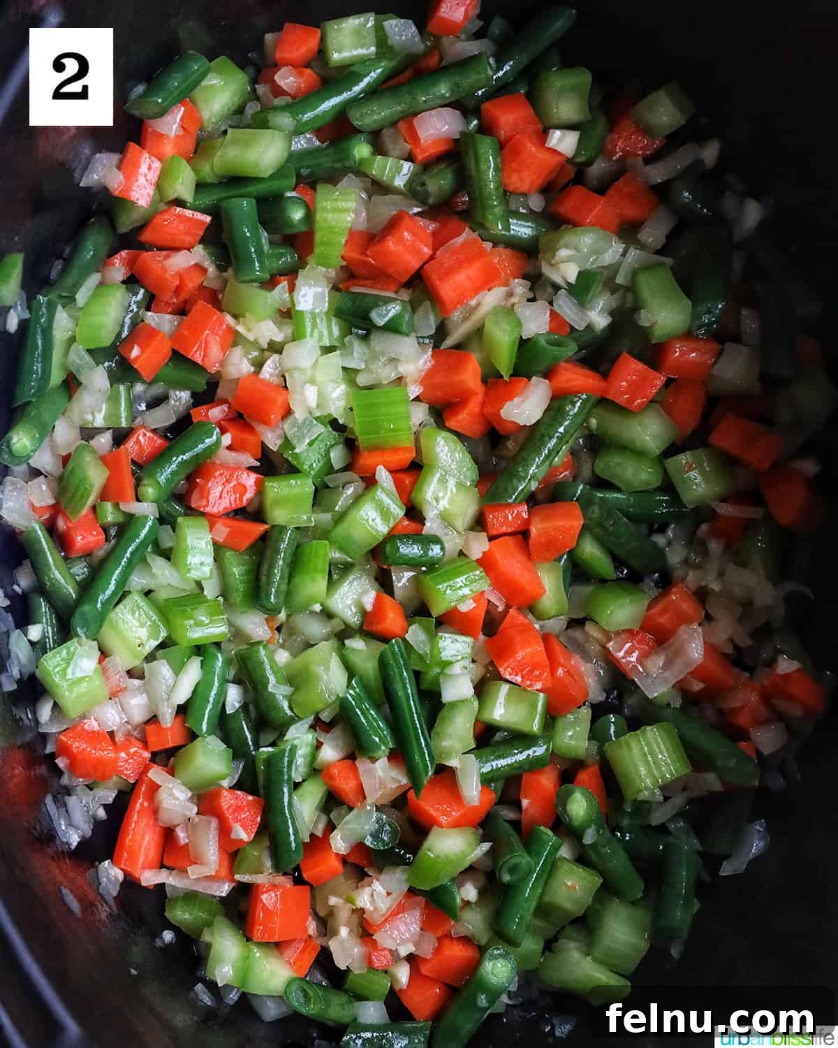 Chicken Minestrone Soup Delight 6 Carrots, celery, onions, and green beans sautéing in a pan, creating a fragrant and flavorful foundation for the soup.