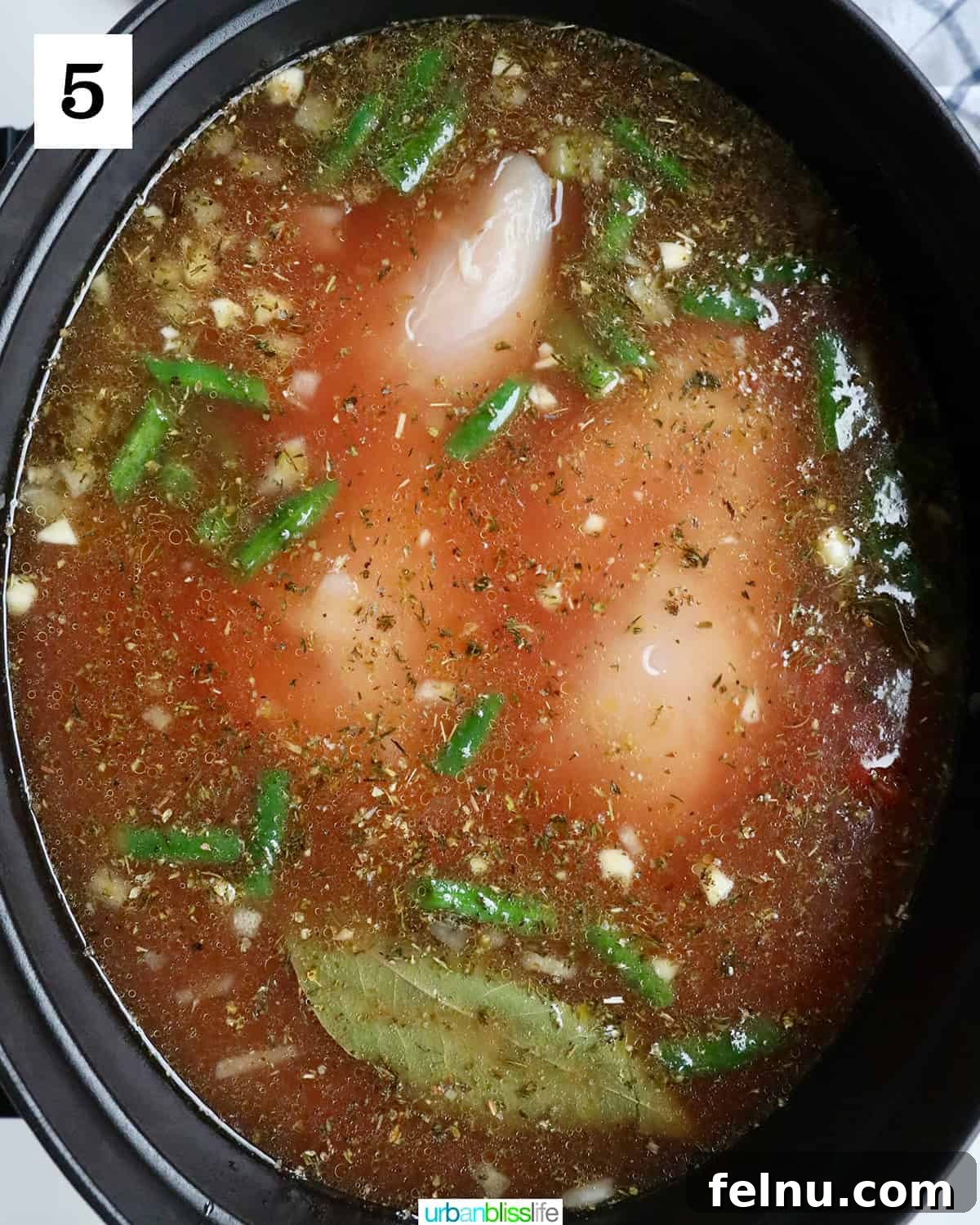 Chicken Minestrone Soup Delight 9 Chicken Minestrone Soup simmering in a Dutch oven, allowing the flavors to meld and deepen.