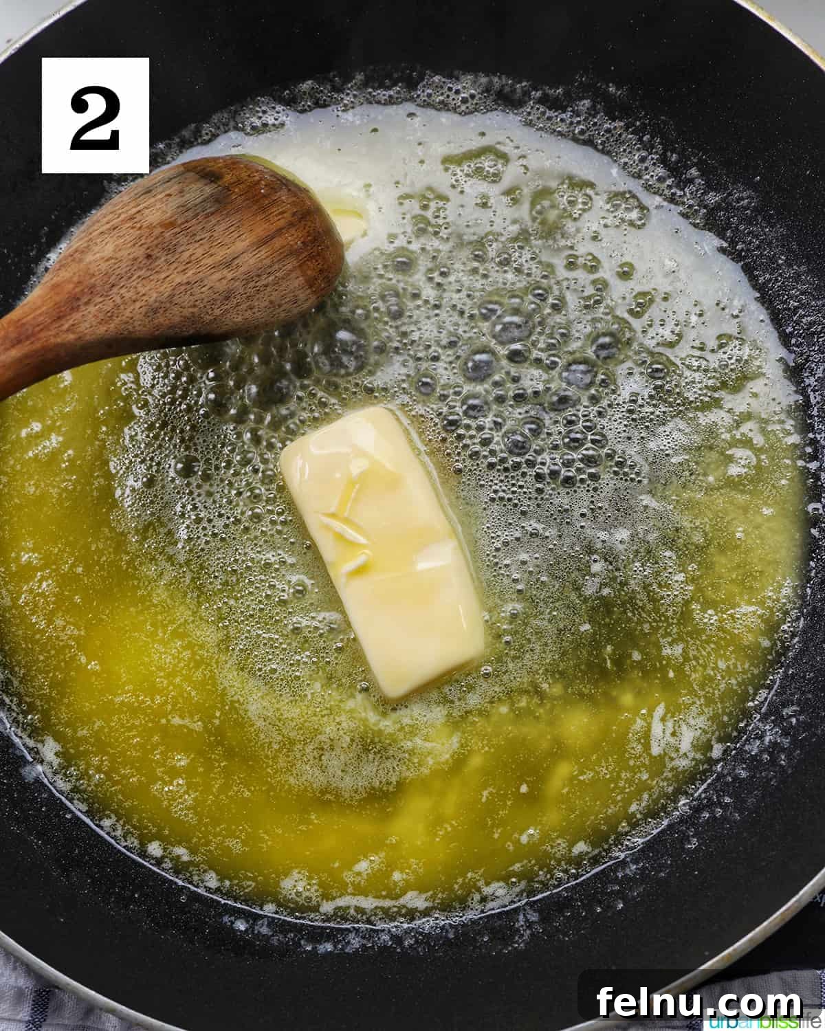 Luxurious Lobster Pasta 6 wooden spoon and melting butter in a nonstick skillet.