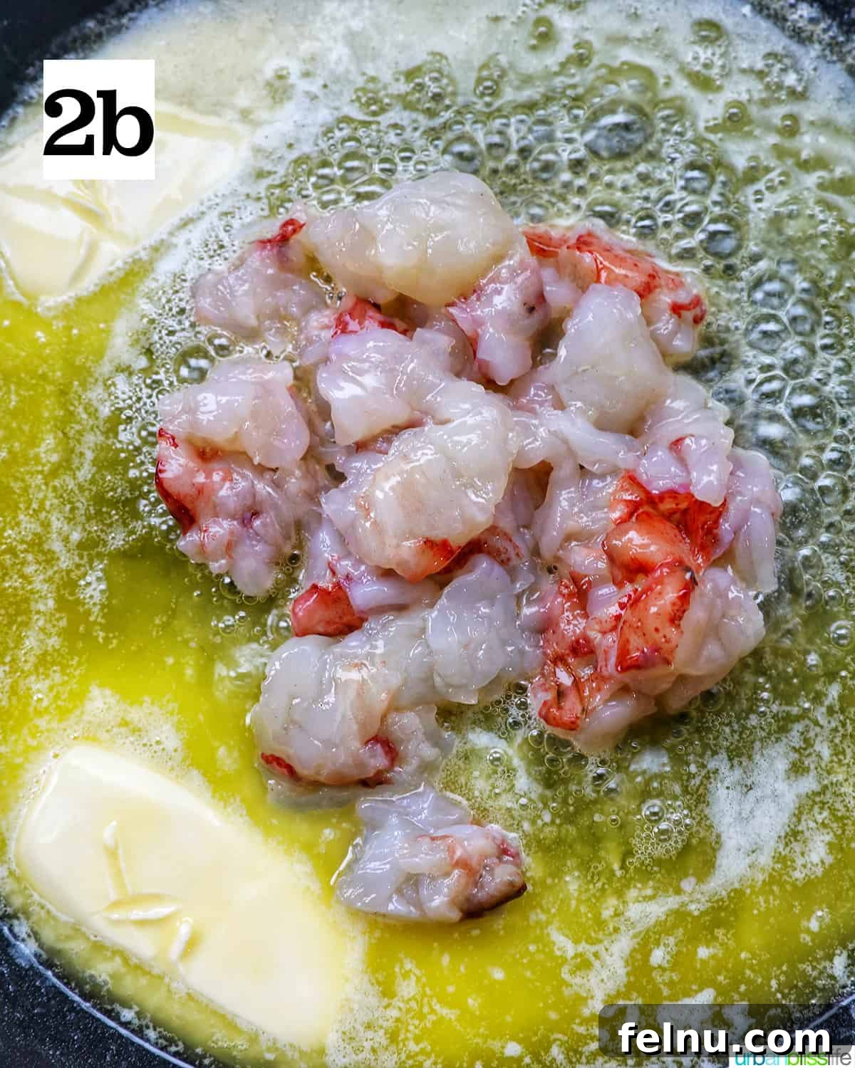 Luxurious Lobster Pasta 7 adding lobster meat to butter melting in a skillet.