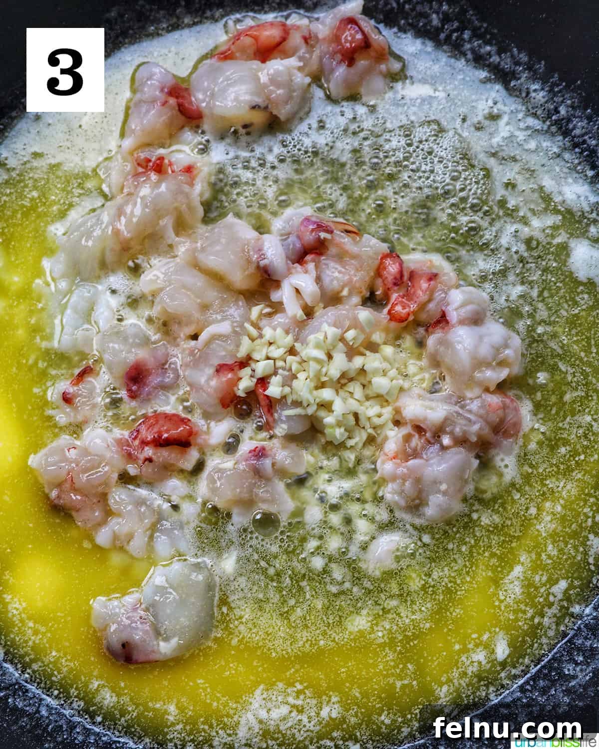 Luxurious Lobster Pasta 8 adding garlic to lobster meat and butter in a skillet.