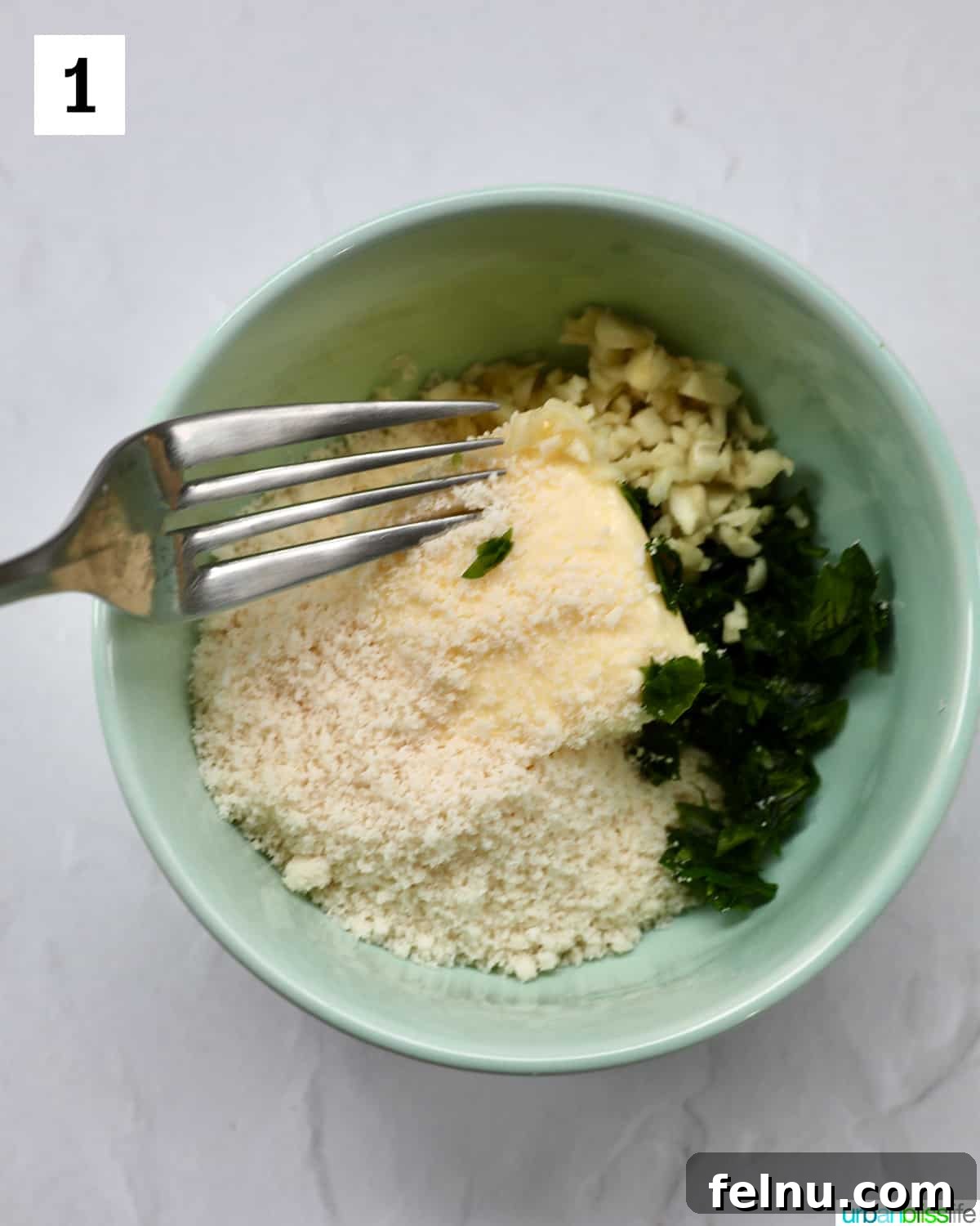 Air Fryer Garlic Toast 5 Unmixed garlic butter spread ingredients in a bowl.