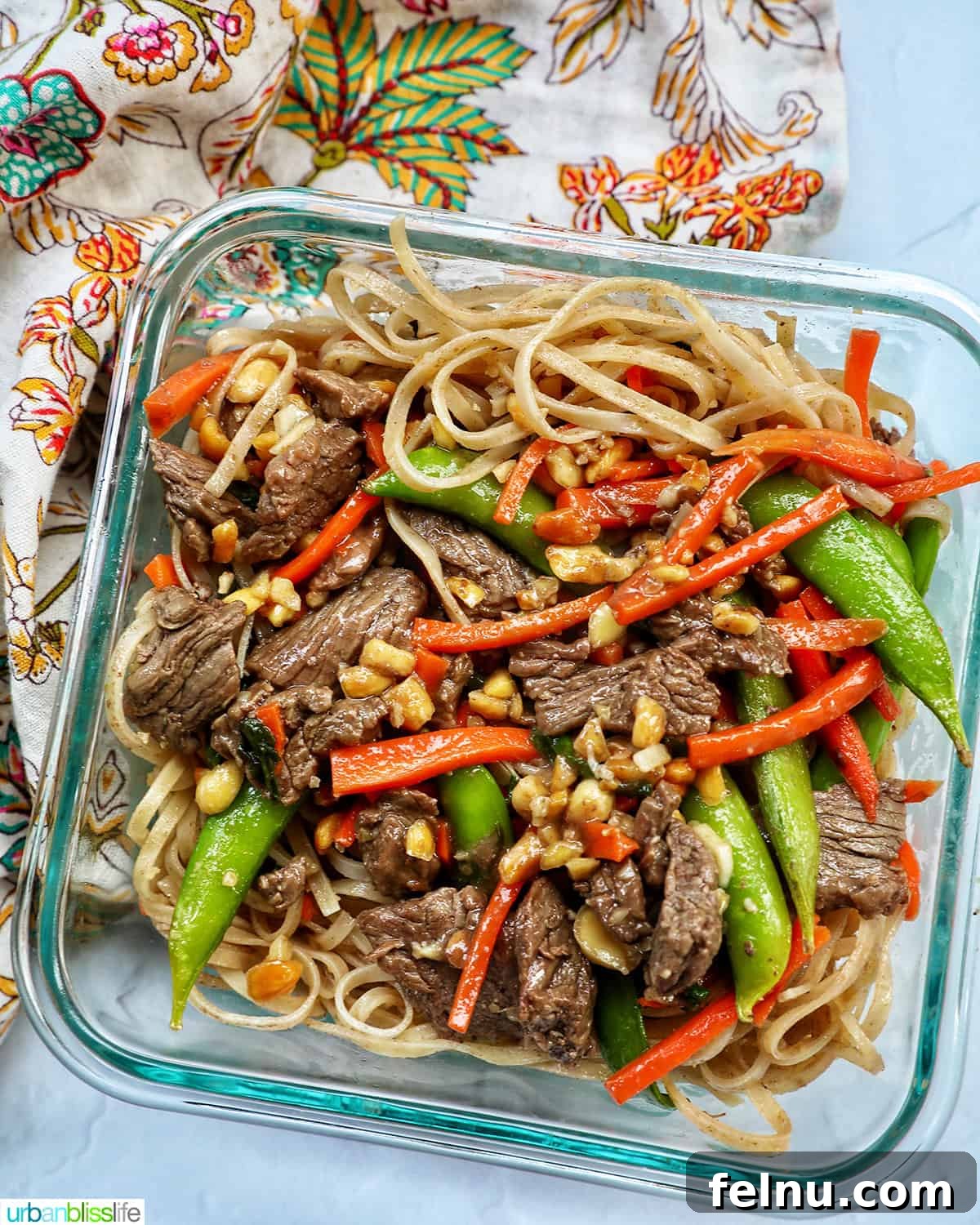 Beef Pad Thai 14 Beef pad thai noodles with vegetables in a meal prep glass container.