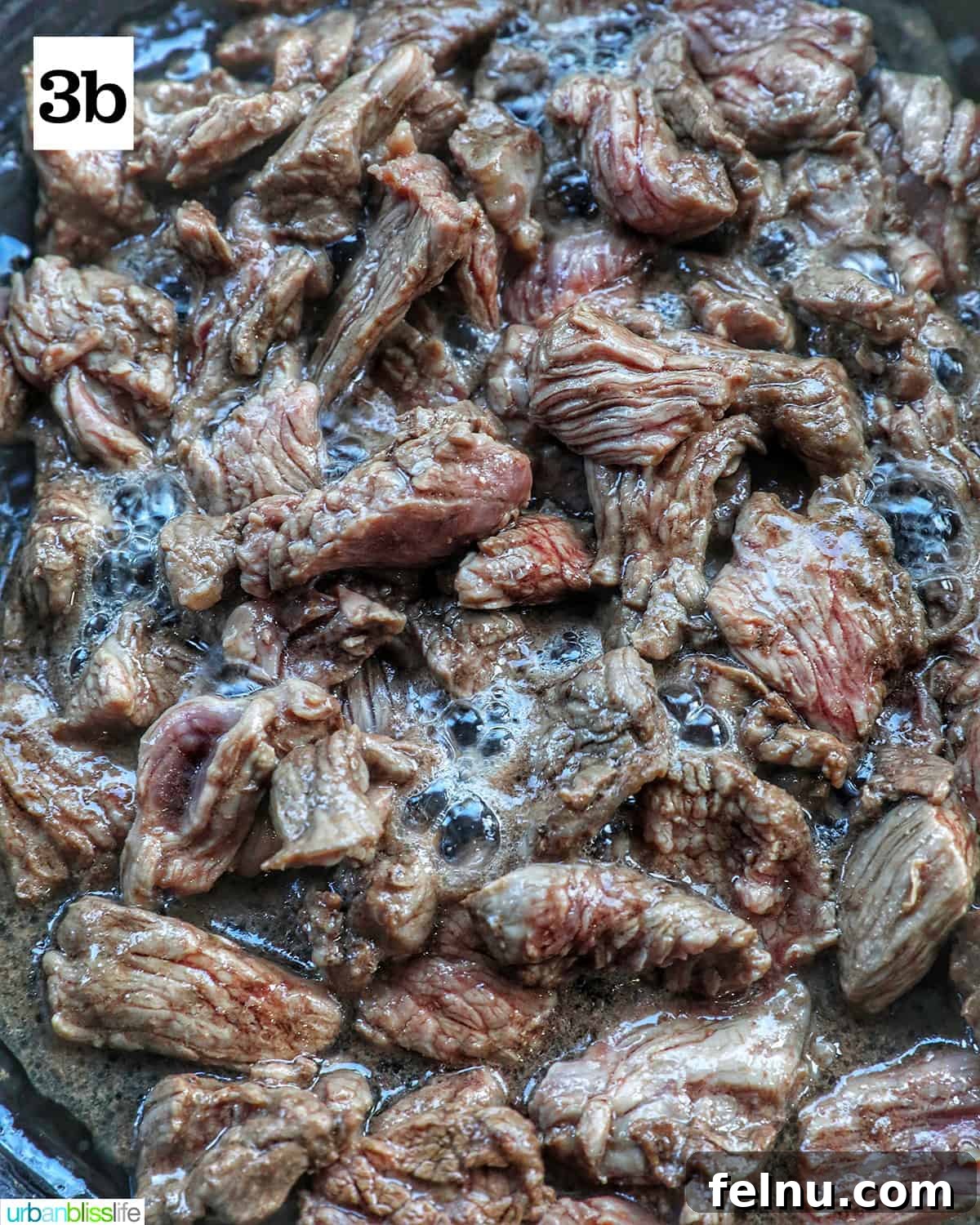 Beef Pad Thai 8 Steak cooking in a cast iron skillet.