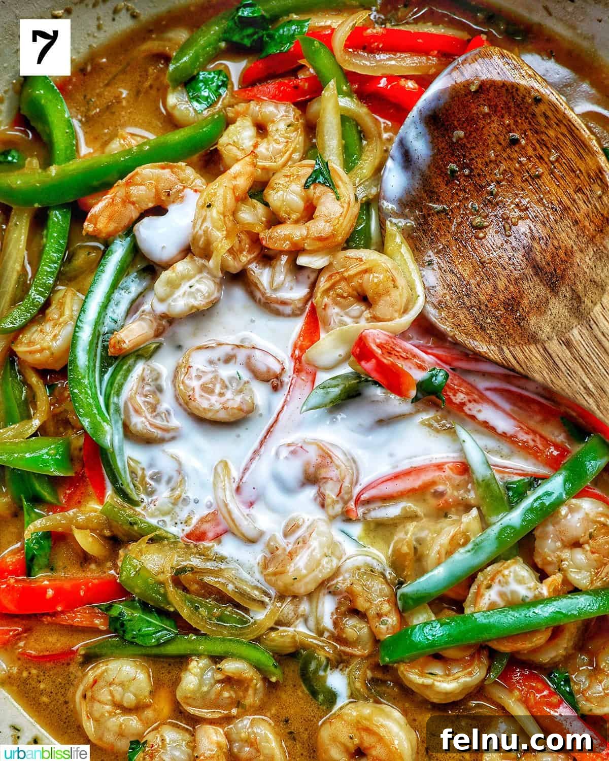 Thai Basil Prawn Stir-Fry 11 Adding coconut milk to the stir-fry.