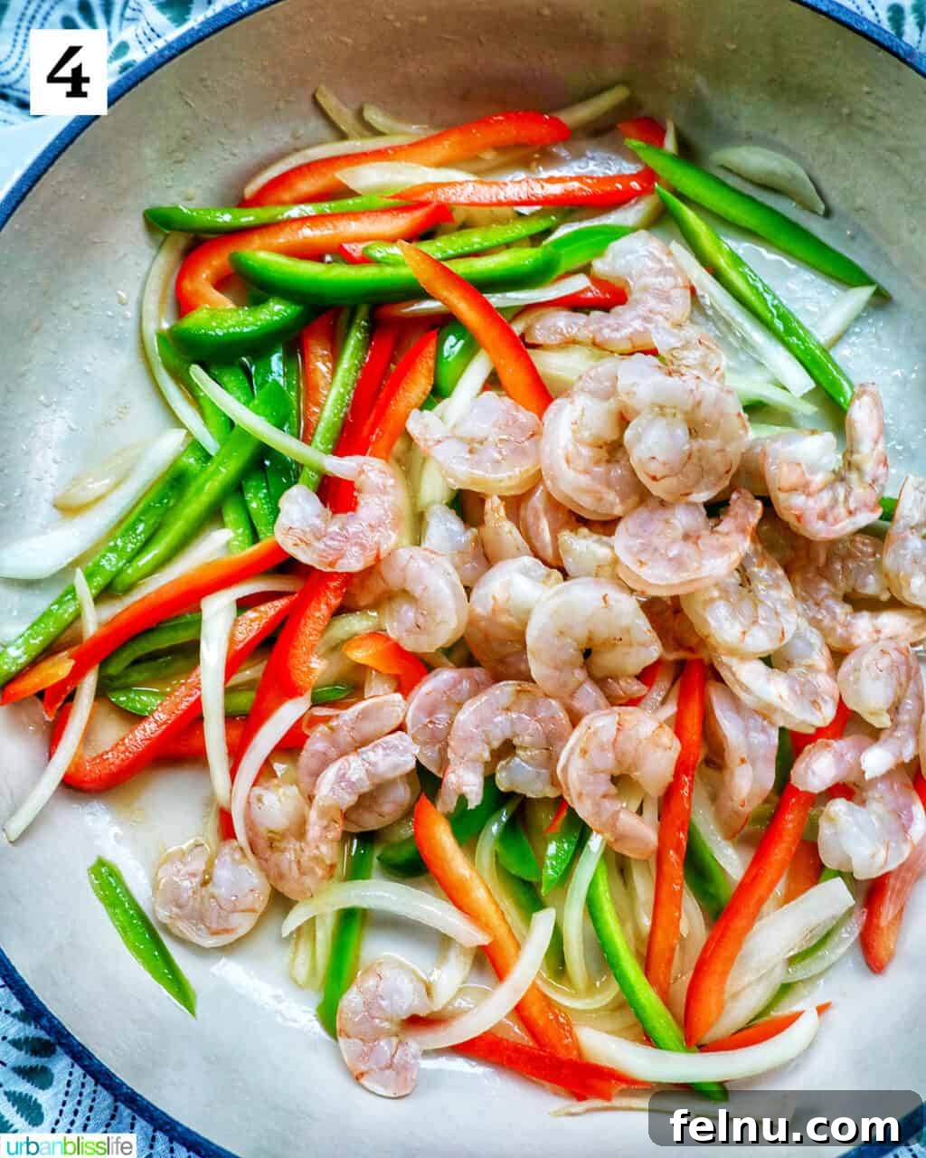 Thai Basil Prawn Stir-Fry 9 Adding shrimp to the wok with the vegetables.