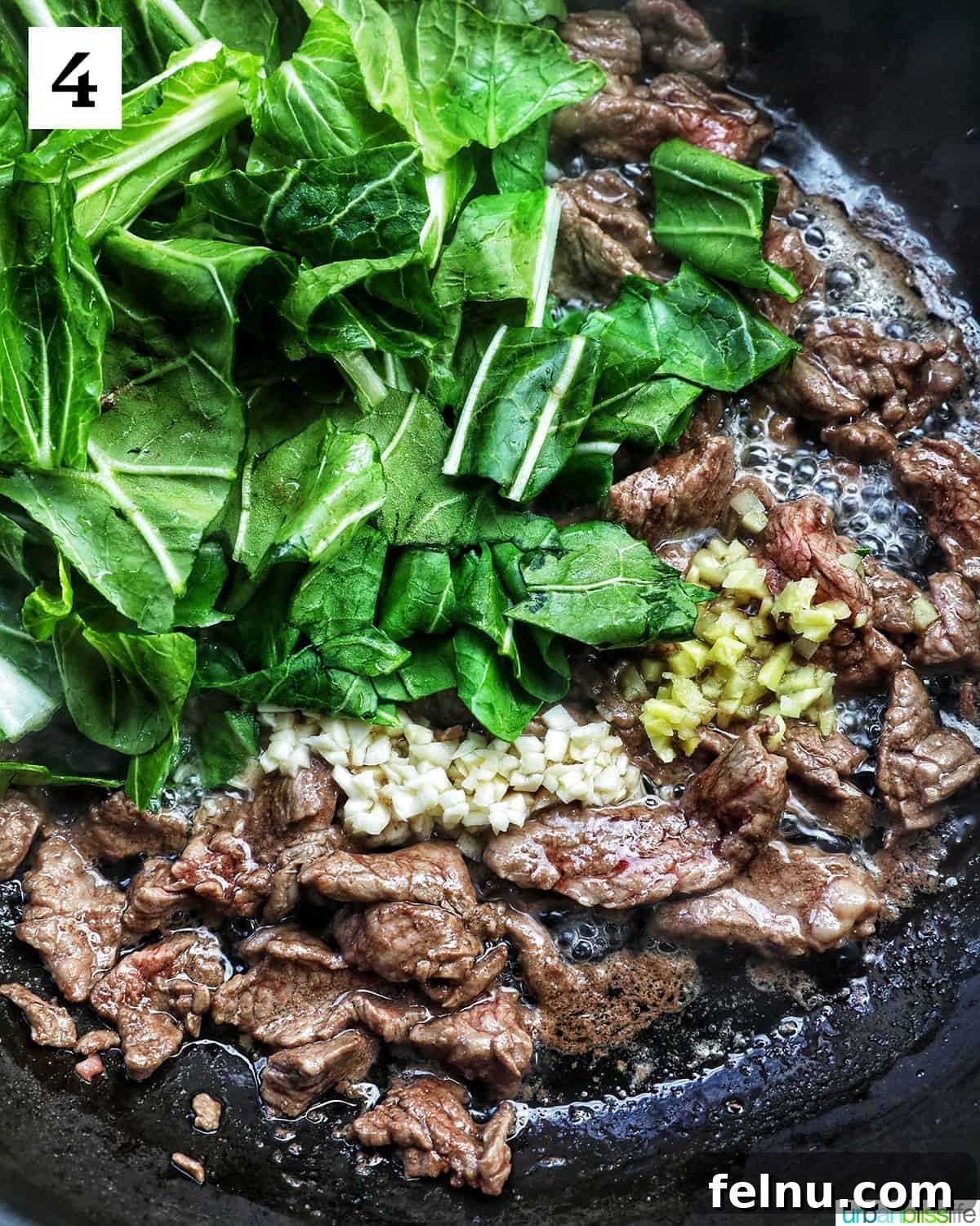 Savory Thai Beef Pad See Ew Noodles 9 Tender beef and fresh bok choy stir-frying in a wok with minced garlic and ginger, filling the air with aromatic steam.