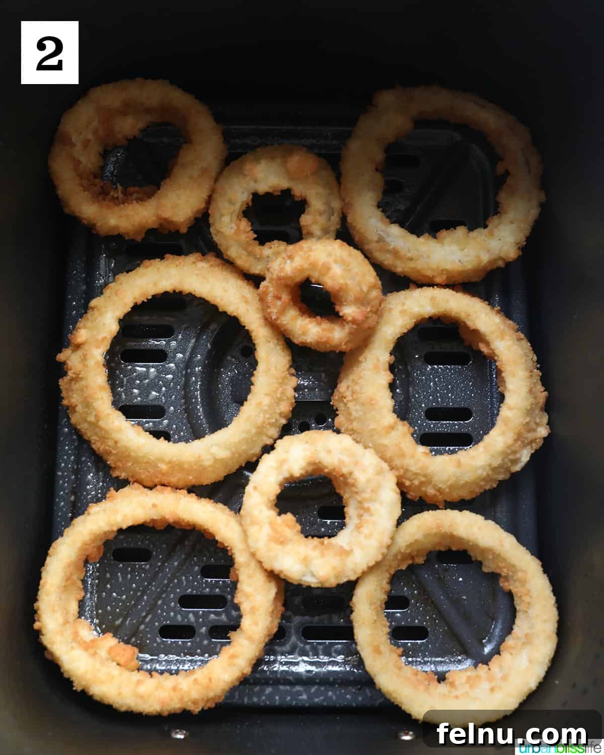 Air Fryer Frozen Onion Rings: Crispy Perfection 6 Frozen onion rings in an air fryer basket