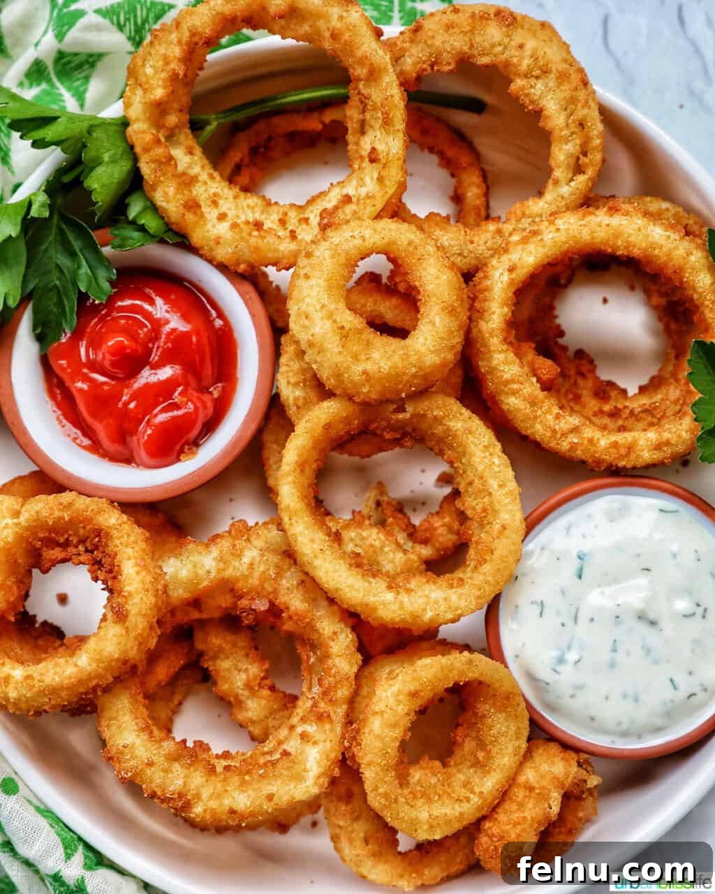 Air Fryer Frozen Onion Rings: Crispy Perfection 8 Bowl of air fryer onion rings with ranch and ketchup