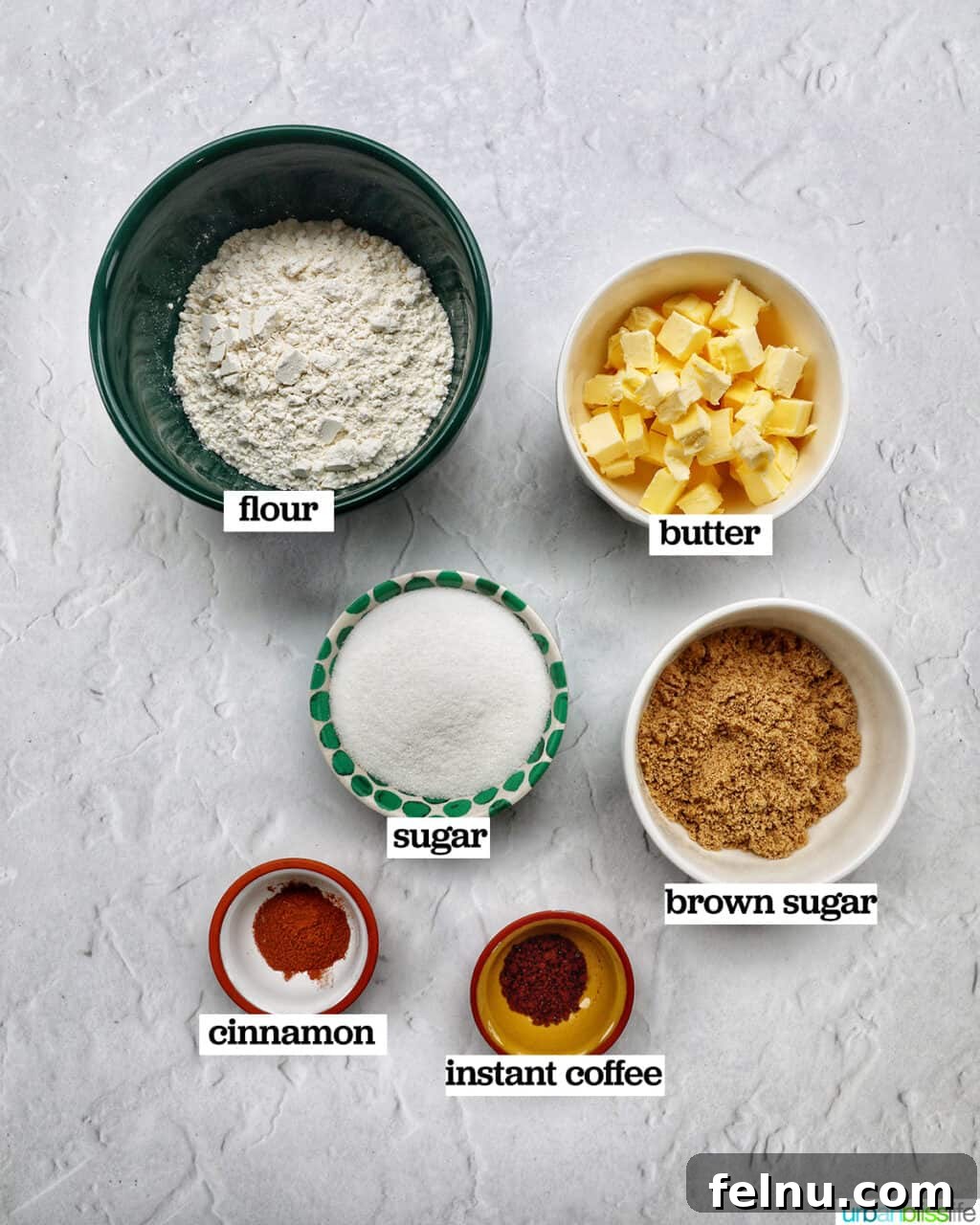 Emerald Isle Coffee Cake 4 Various bowls holding ingredients for the crunchy streusel topping of Irish coffee cake, including flour, sugars, cinnamon, and cubed cold butter.