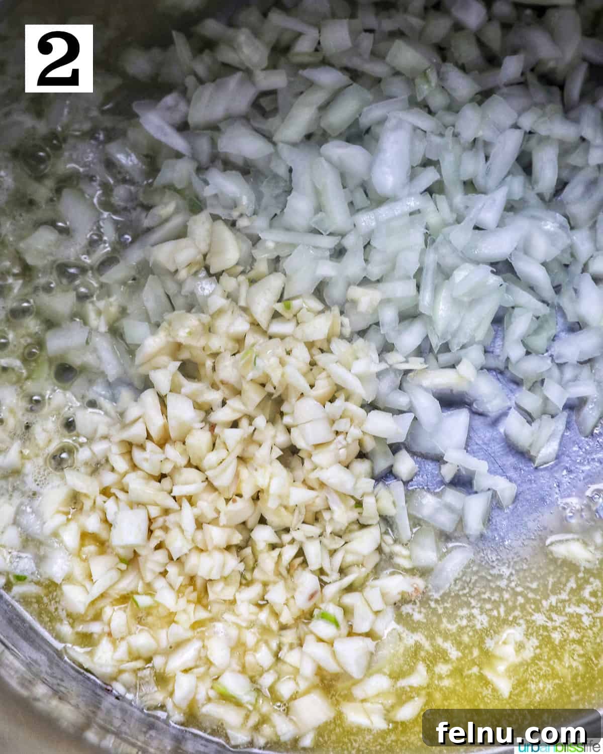 Effortless Instant Pot Cabbage 6 Minced garlic and diced yellow onions being stirred and sautéed in the Instant Pot until fragrant.