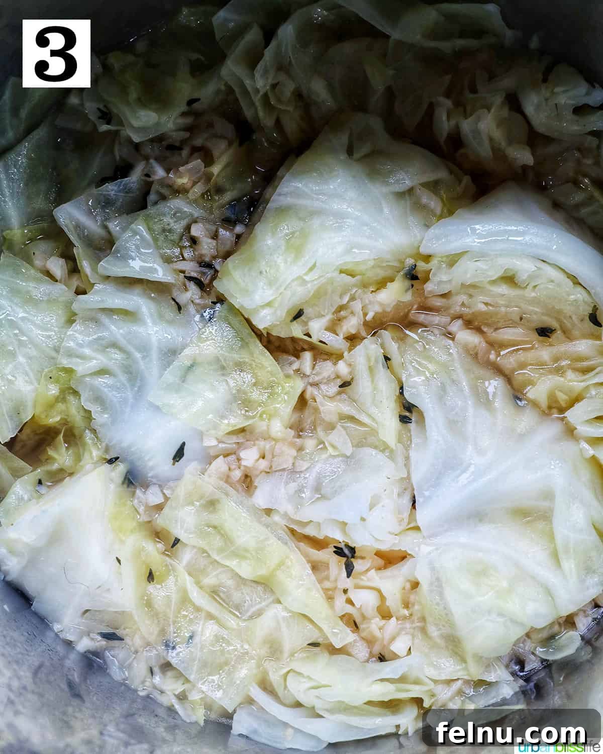 Effortless Instant Pot Cabbage 7 Dried thyme, kosher salt, and black pepper added to the sautéed garlic and onions in the Instant Pot.