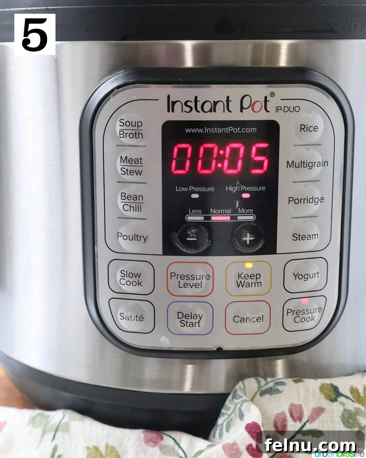 Effortless Instant Pot Cabbage 9 The Instant Pot display showing 'Pressure Cook' mode selected and set for 5 minutes of high pressure cooking time.