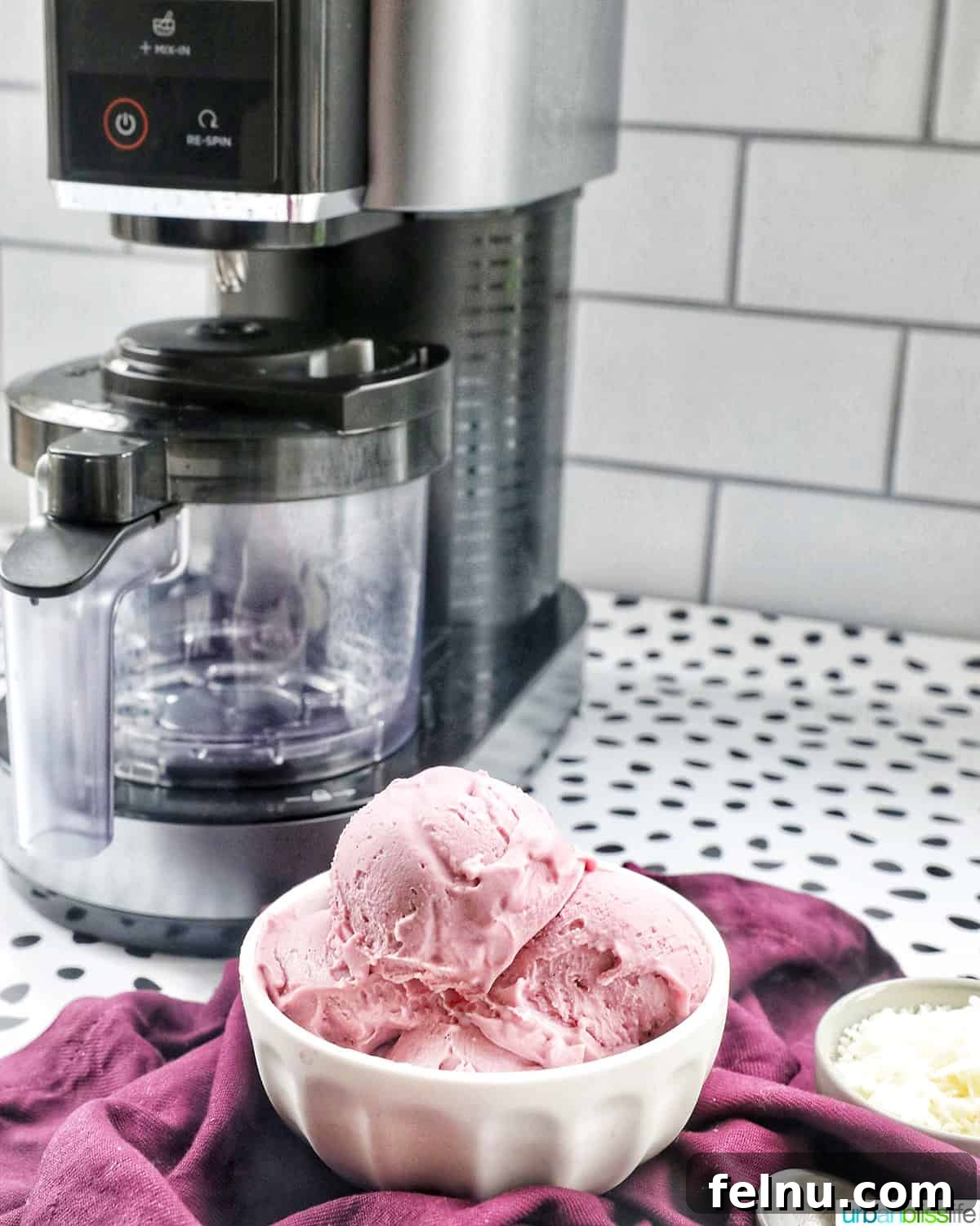 Homemade ube ice cream with the Ninja Creami ice cream machine in the background