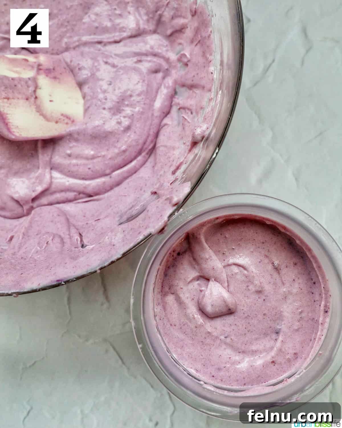 Pouring ube ice cream base mixture into the Ninja Creami pint container
