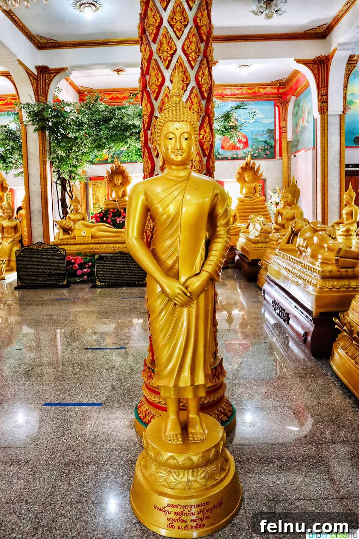 Wat Chalong Temple: A Spiritual Journey in Phuket 16 Golden Buddha statues inside the prayer hall of Wat Chalong Temple in Phuket, Thailand, reflecting the temple's rich spiritual heritage.