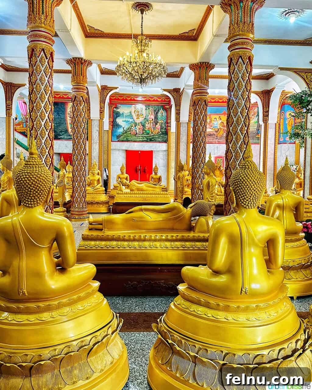 Wat Chalong Temple: A Spiritual Journey in Phuket 5 A collection of golden Buddha statues within the prayer hall of Wat Chalong Temple in Phuket, Thailand, representing the temple's profound spiritual essence.