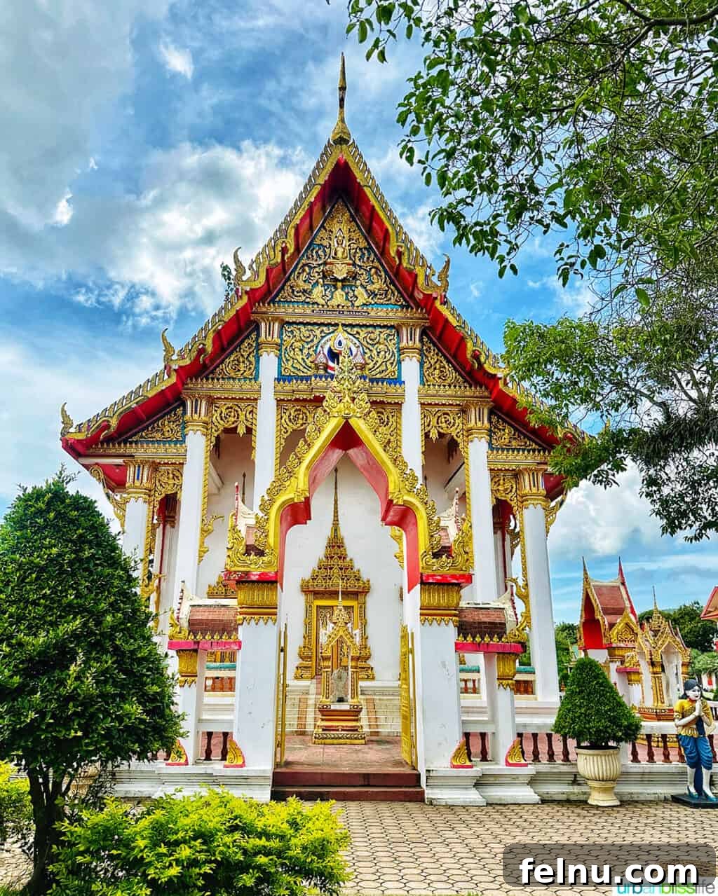 Wat Chalong Temple: A Spiritual Journey in Phuket 8 The magnificent prayer hall of Wat Chalong Temple in Phuket, Thailand, showcasing its intricate gold and red design.