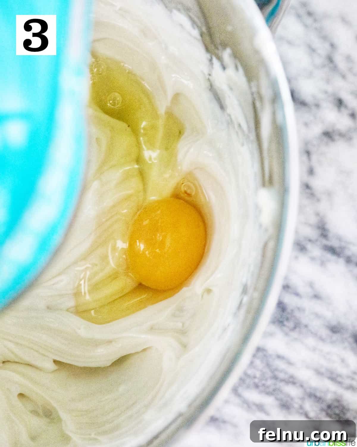Easter Egg Delight Cheesecake 15 Mixing in the eggs.