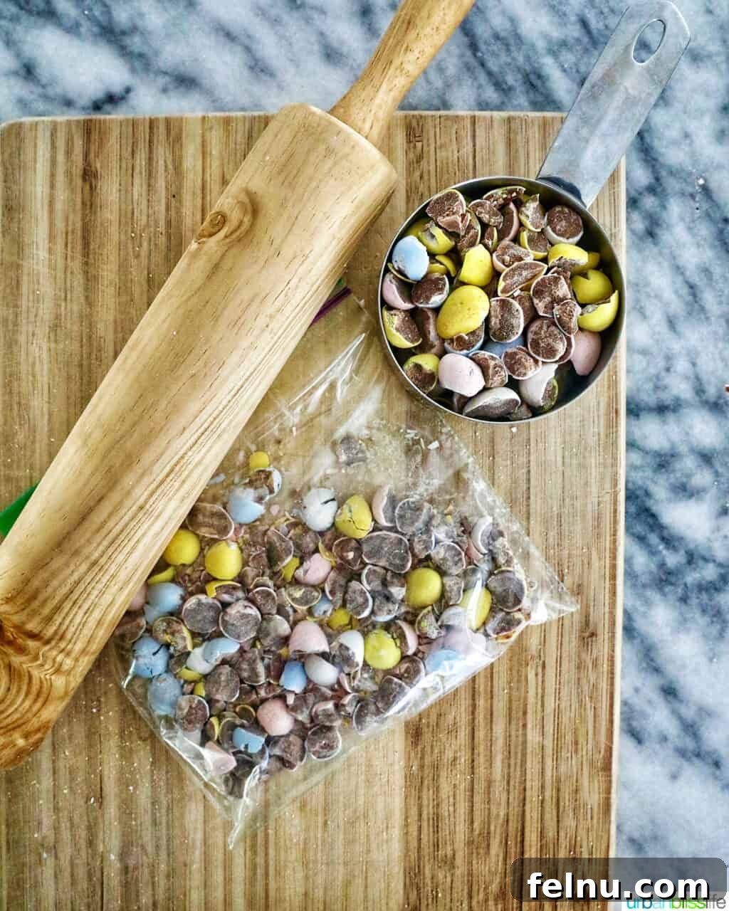 Easter Egg Delight Cheesecake 8 Chopping mini chocolate eggs on a cutting board.