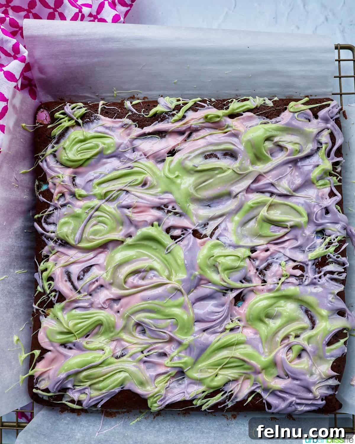 Easter Chocolate Squares 19 Pink, green, and purple white chocolate beautifully swirled on top of Easter brownies.