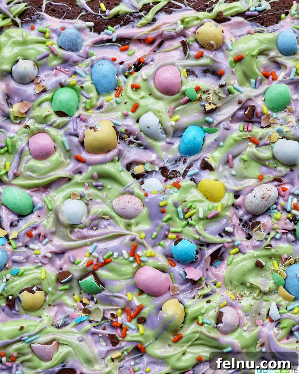 Easter Chocolate Squares 3 Close-up of Easter brownies showcasing the colorful frosting and mini chocolate Easter eggs.