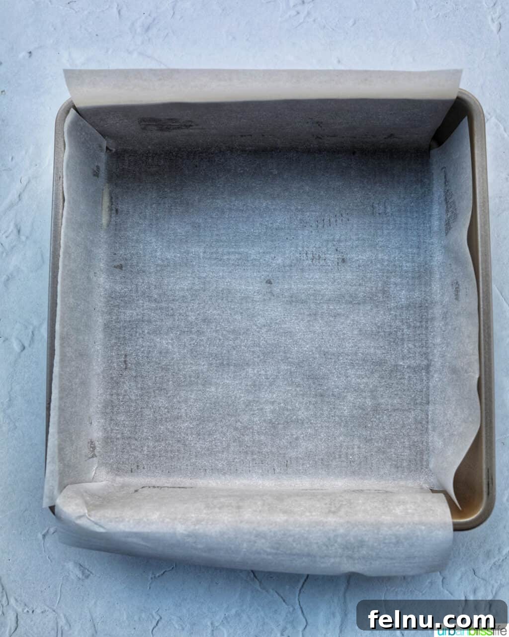 Easter Chocolate Squares 5 A square baking pan carefully lined with parchment paper.