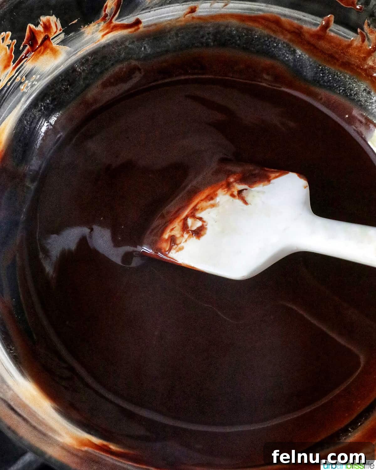 Easter Chocolate Squares 8 Close-up of melted chocolate and butter, creating a smooth and glossy mixture.