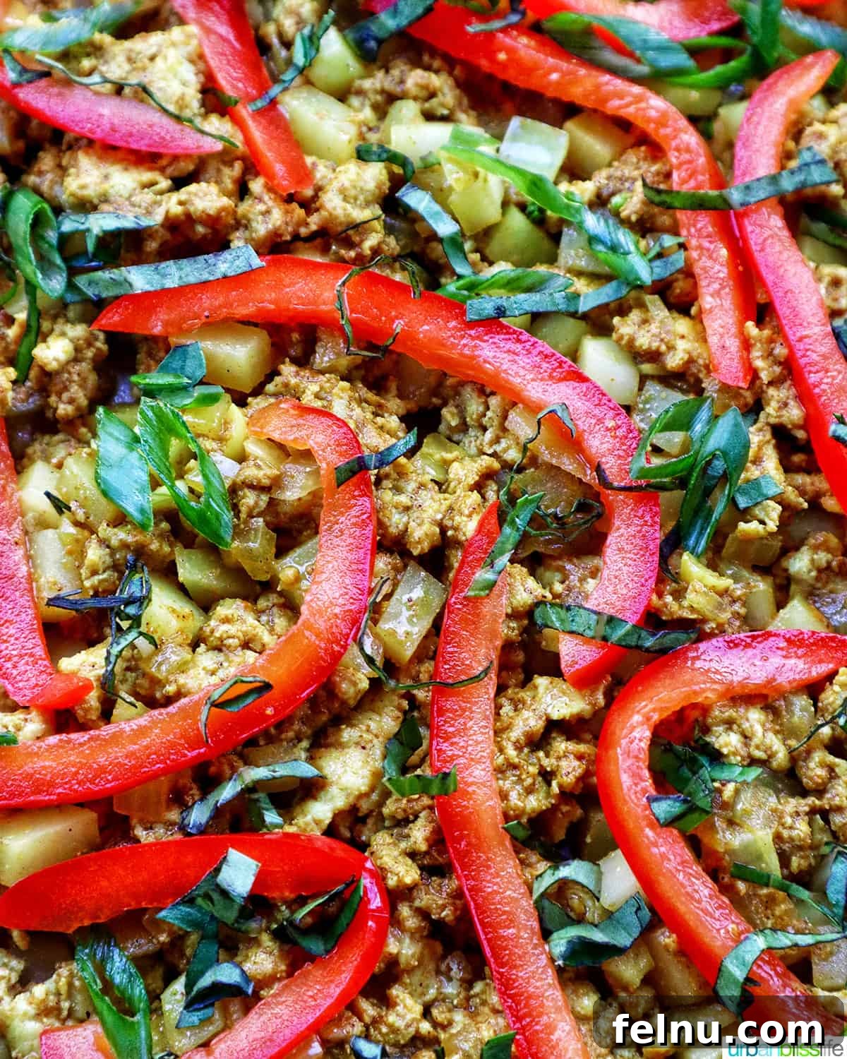 Thai Curry Pizza Delight 11 Close-up of Thai curry pizza toppings with sliced red peppers and fresh basil