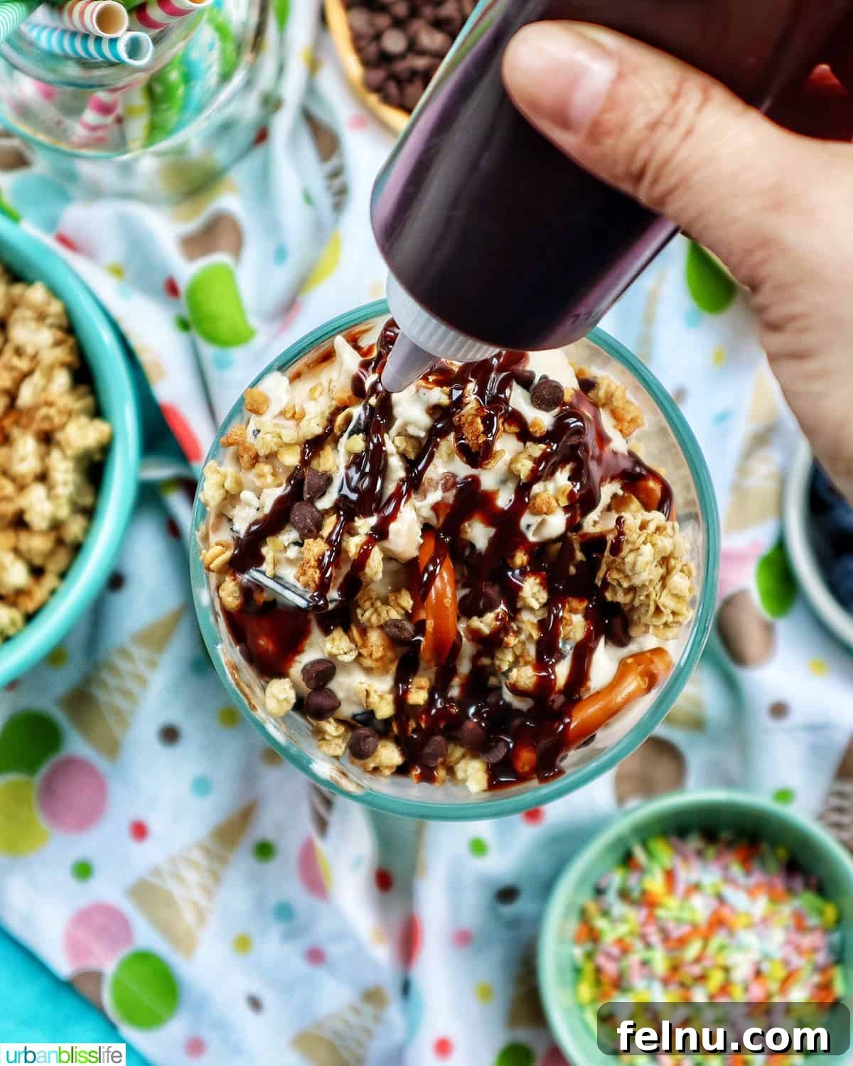 Ice Cream Parfait: A Symphony of Flavors and Textures 11 Squeeze bottle of chocolate syrup being poured over ice cream parfaits, creating a tempting visual.