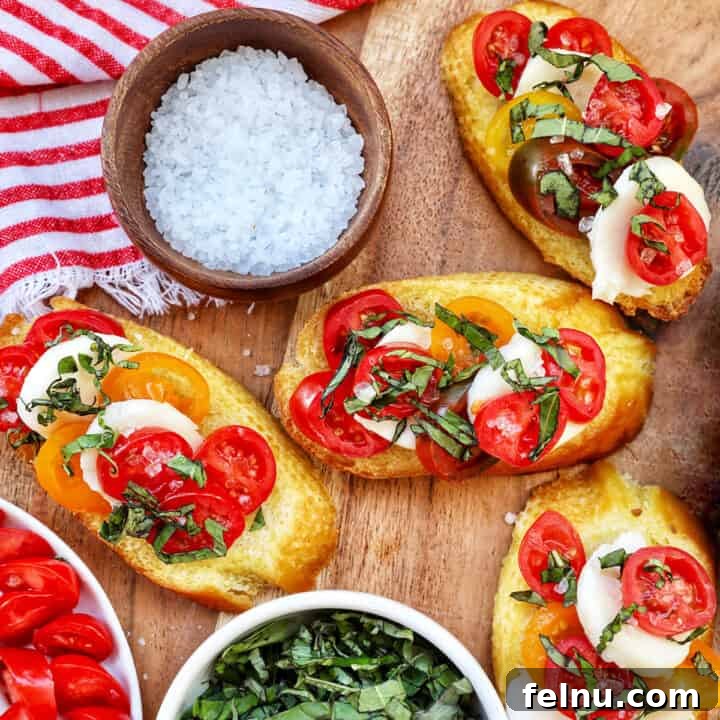 Caprese Crostini ready to be served, showcasing fresh tomatoes, mozzarella, and basil on toasted baguette.
