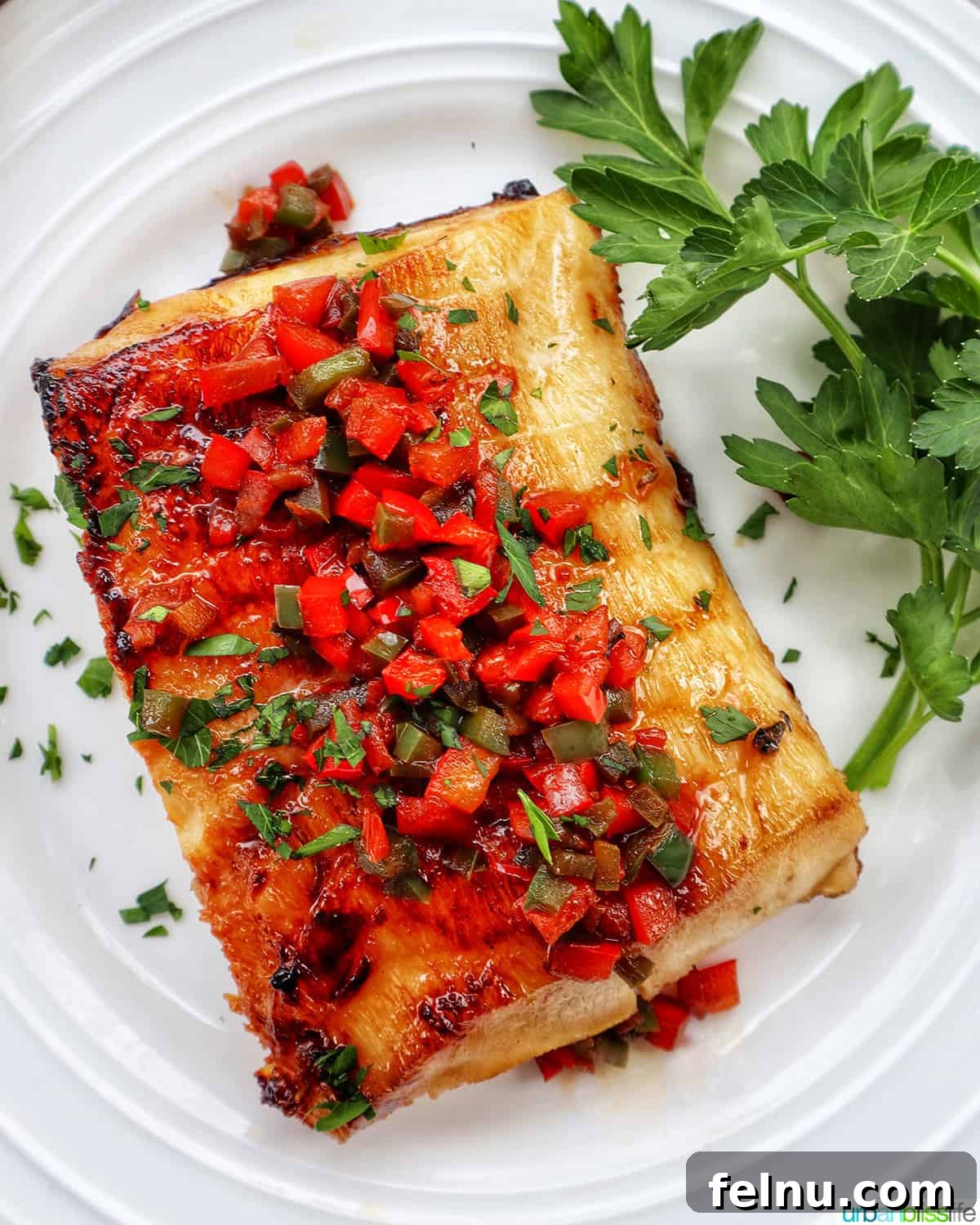 Pan-Fried Sea Bass with Lemon-Herb Butter 3 Pan-Seared Sea Bass with Bell Pepper Relish and Parsley Garnish