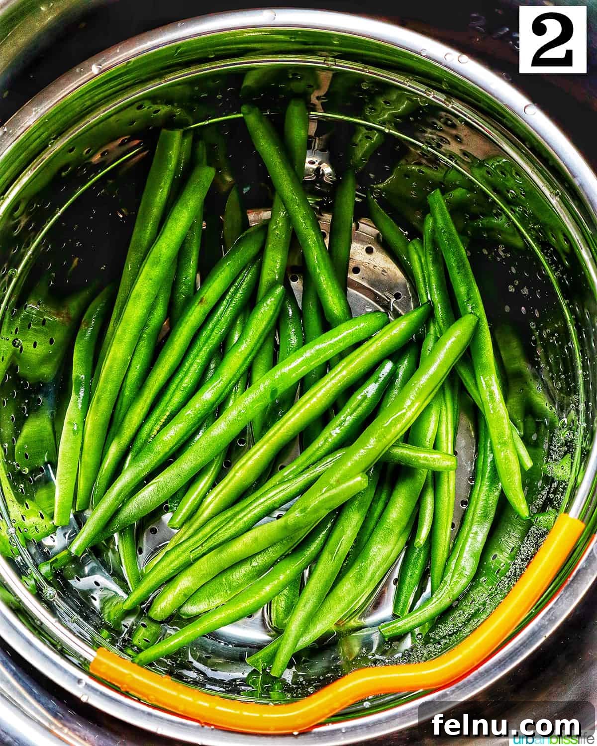 Green beans placed in the steamer basket inside the Instant Pot.