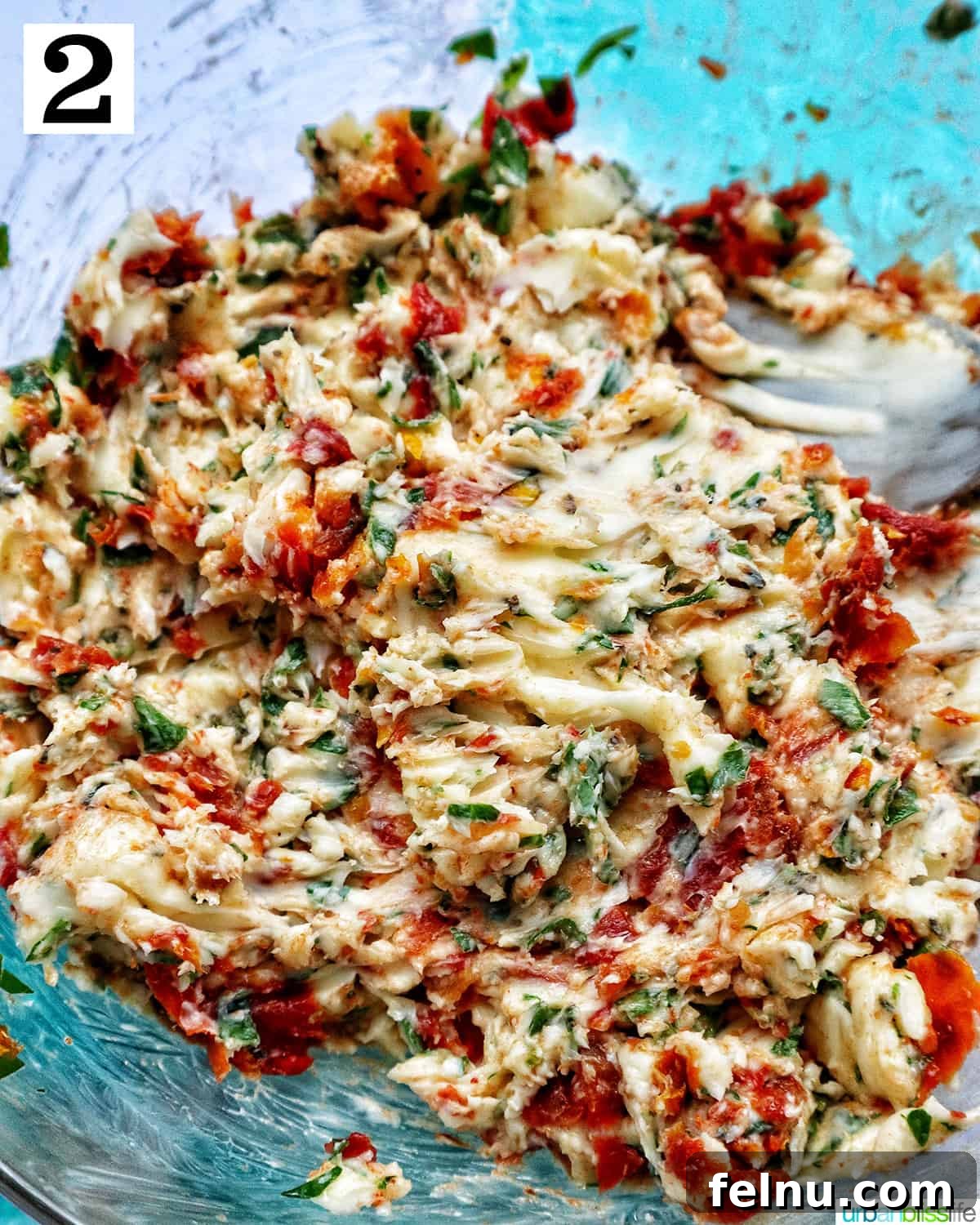 Ingredients mixed together for sun-dried tomato butter.