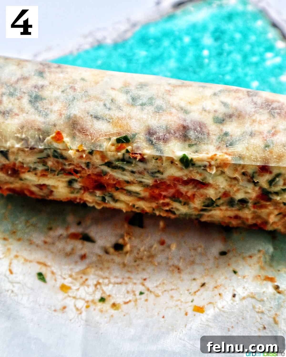 Sun-dried tomato butter wrapped in parchment paper.